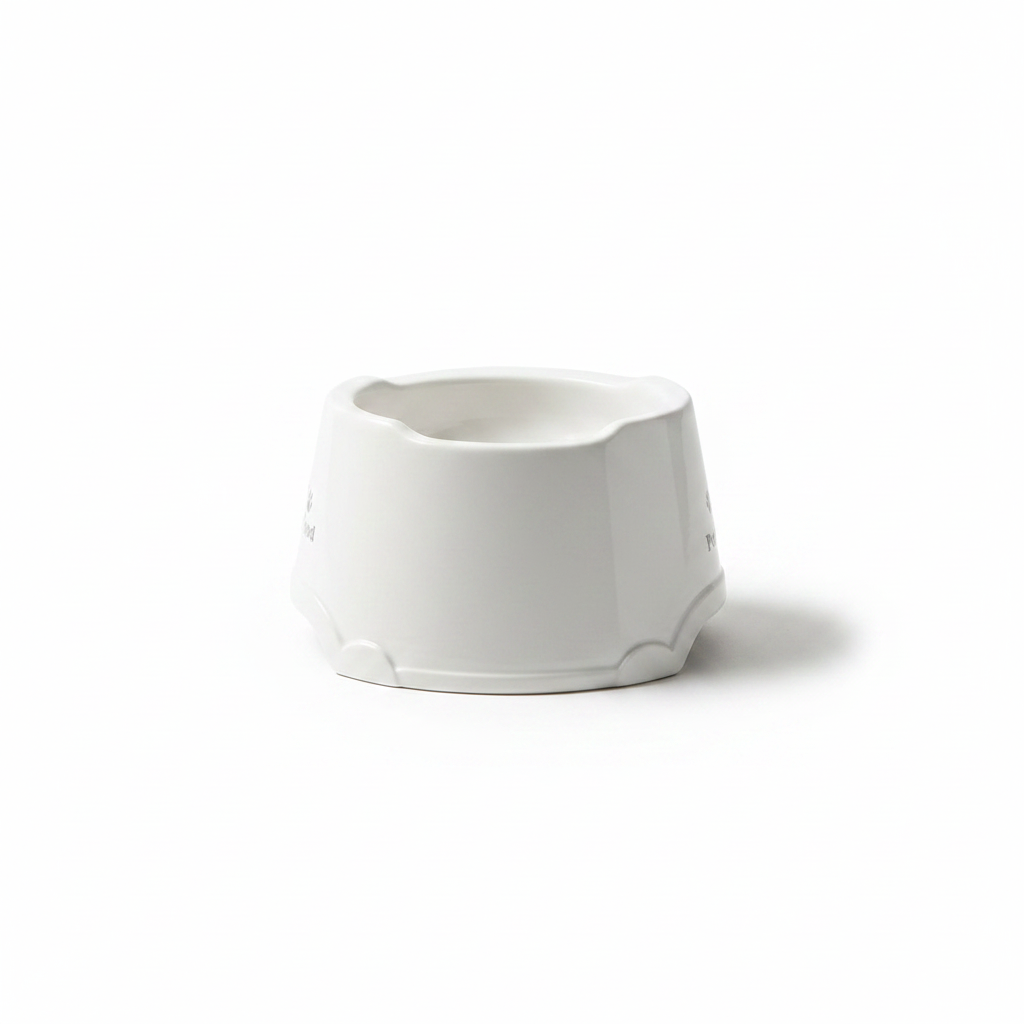 White ceramic pet food bowl with paw print — side profile view