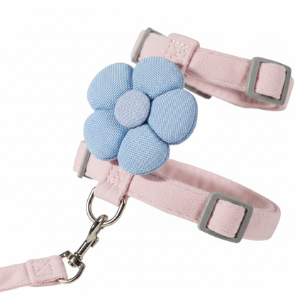Close-up of 3D blue fabric flower decoration on pink cat harness chest piece
